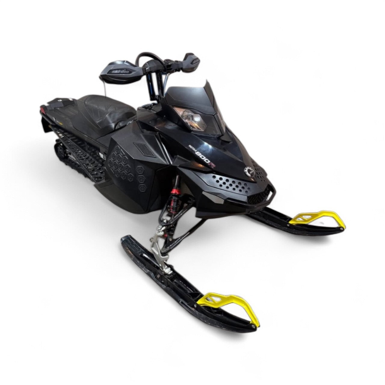Black snowmobile with yellow accents on a white background