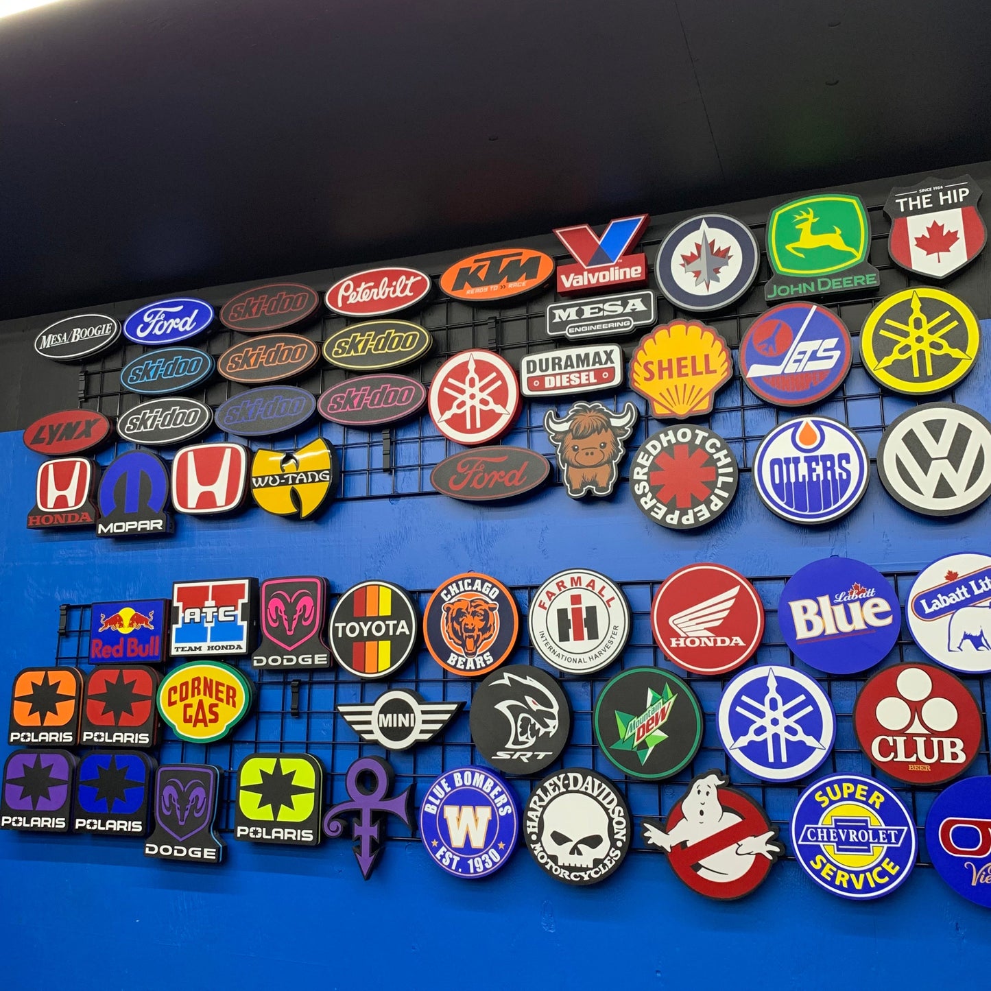 Collection of various brand logos of LED indoor signs on a blue background