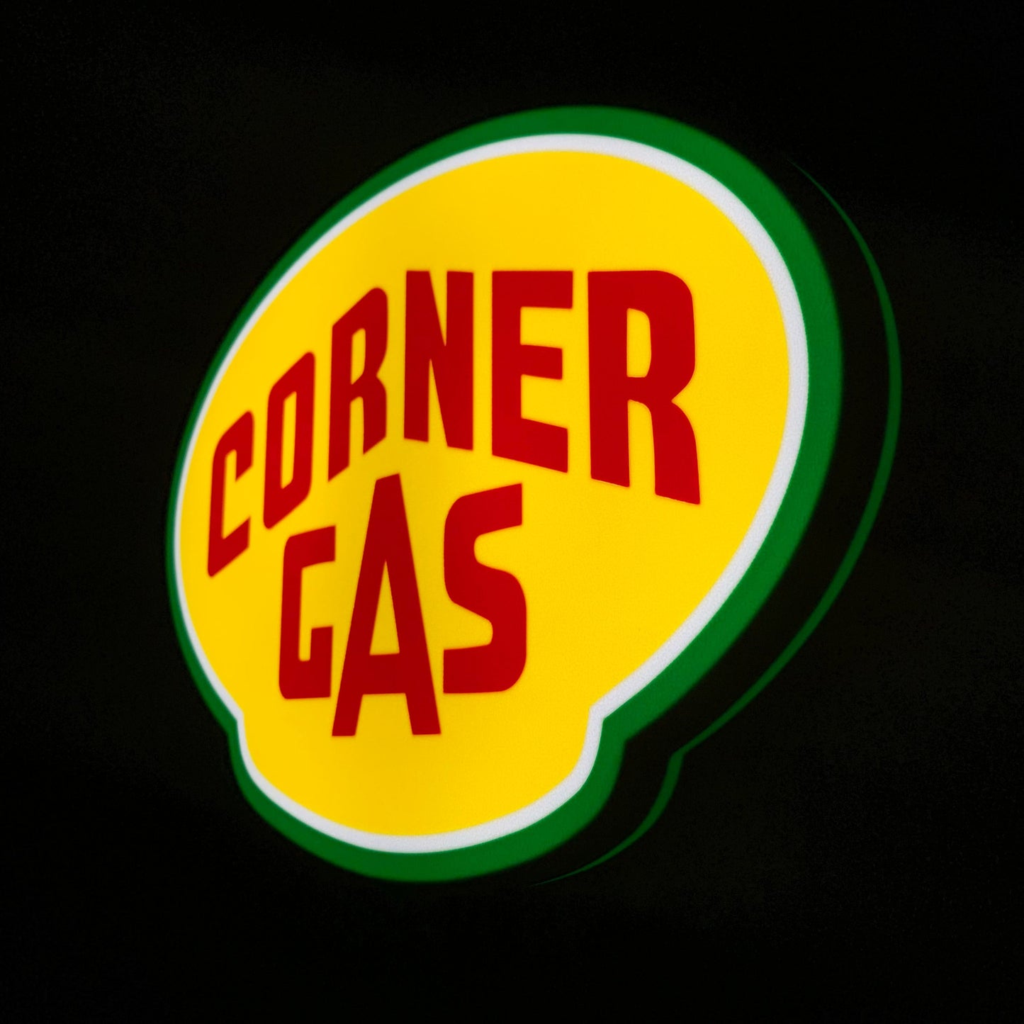 Corner Gas led sign lit up on a black background