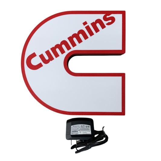 Cummins led indoor sign with a power adapter on a white background