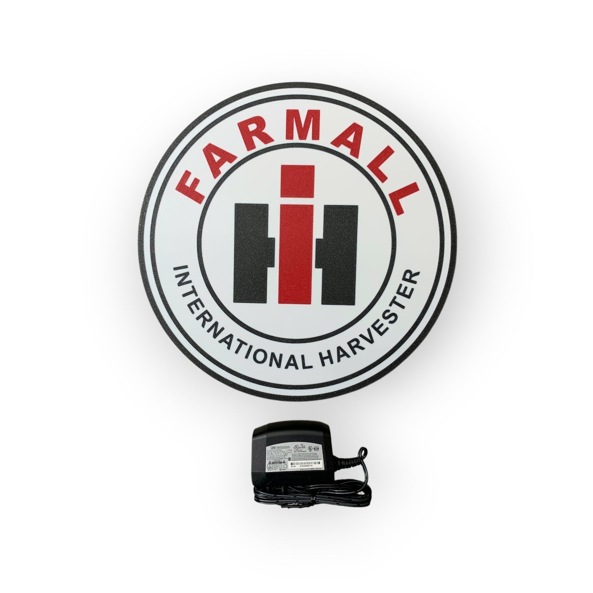 Farmall International Harvester led indoor sign with a black power adapter on a white background