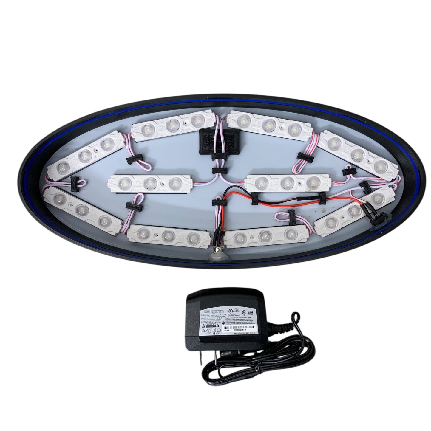 12v LED modules mounted inside an LED indoor sign with a power adaptor