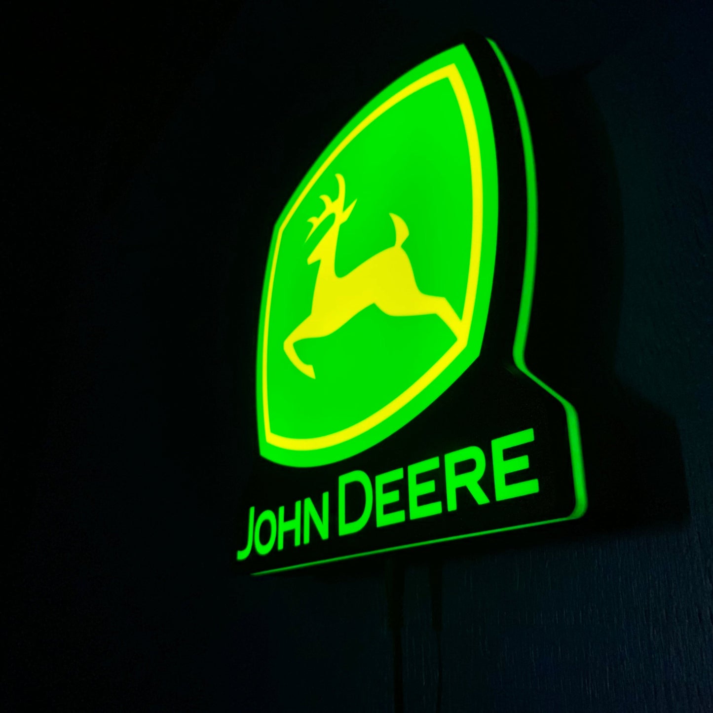 John Deere led indoor sign on a black background