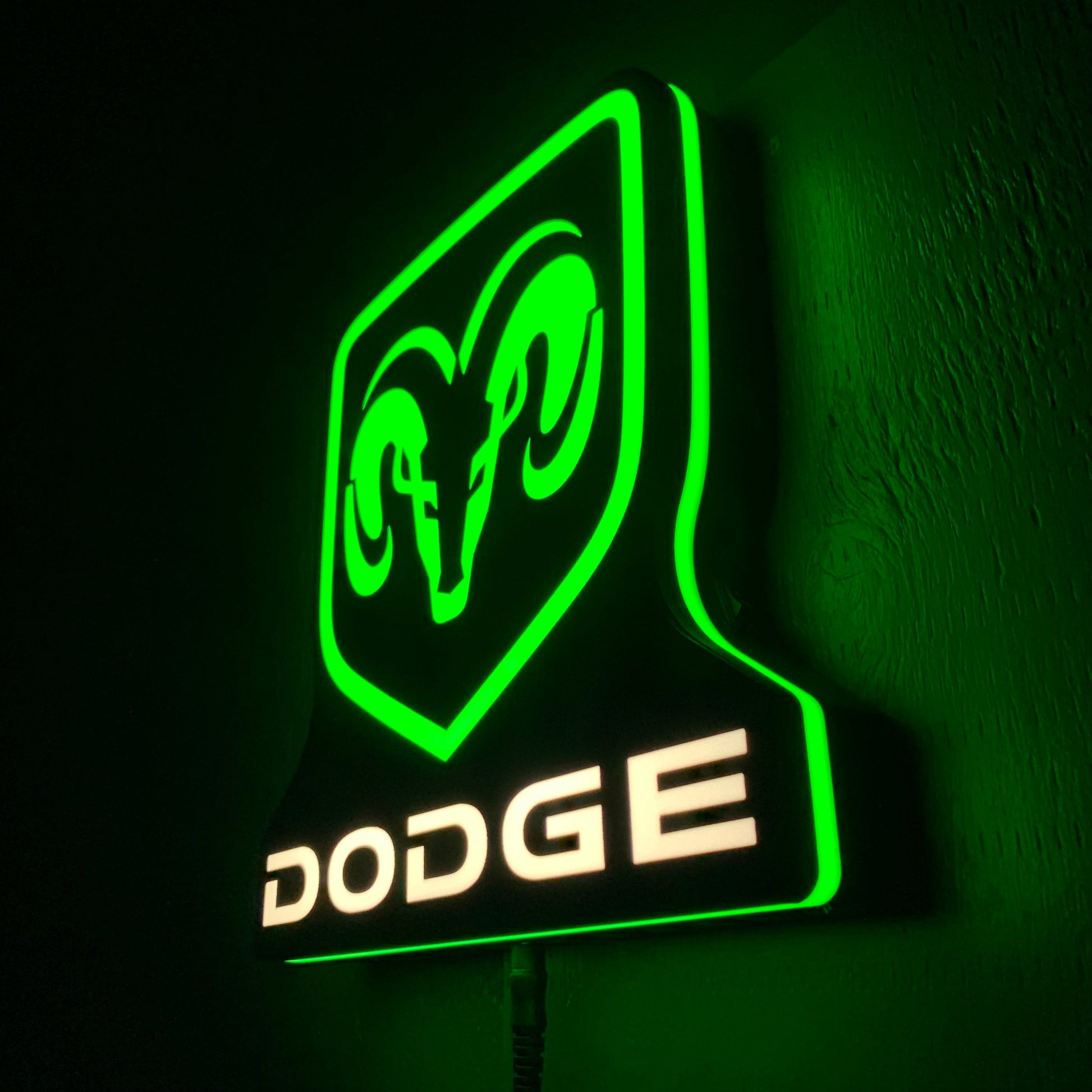 LED indoor sign with Dodge logo on a dark background