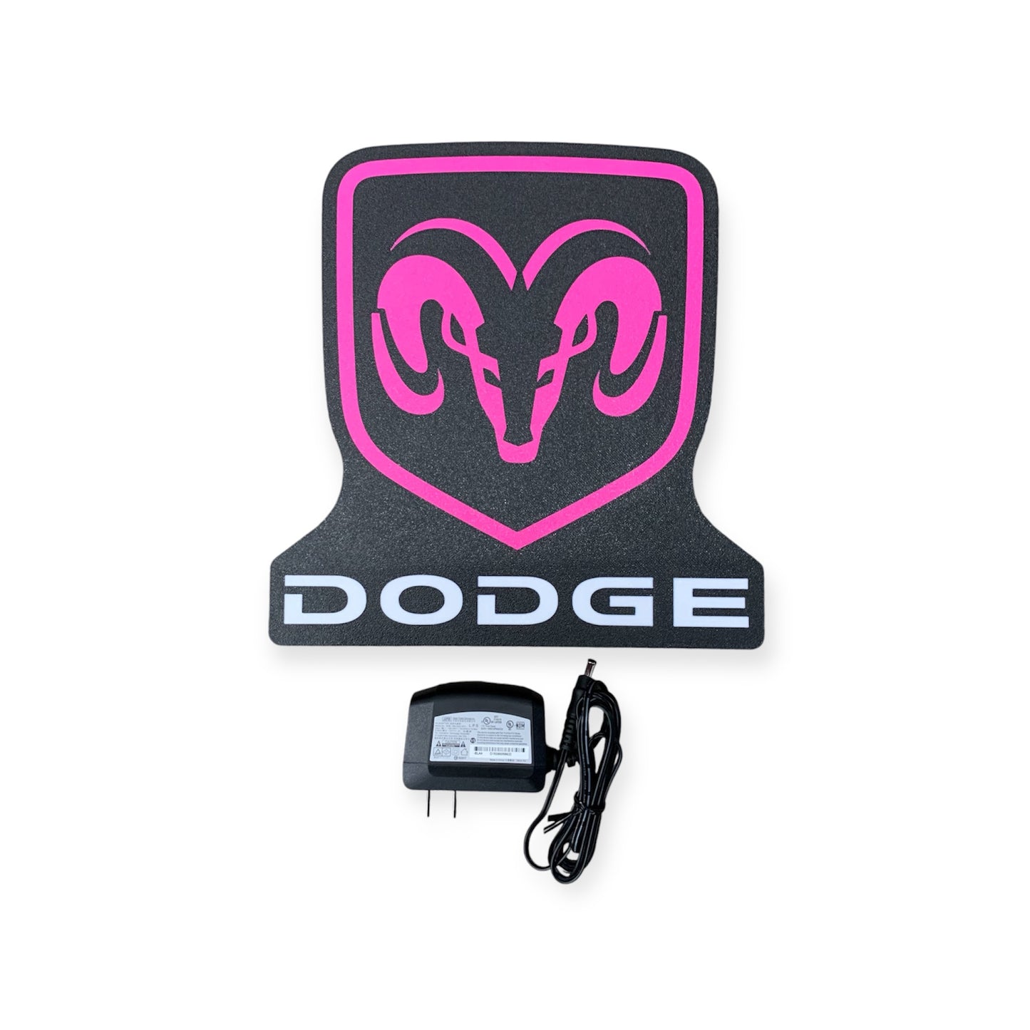 Black and pink Dodge led indoor sign with a power adapter on a white background