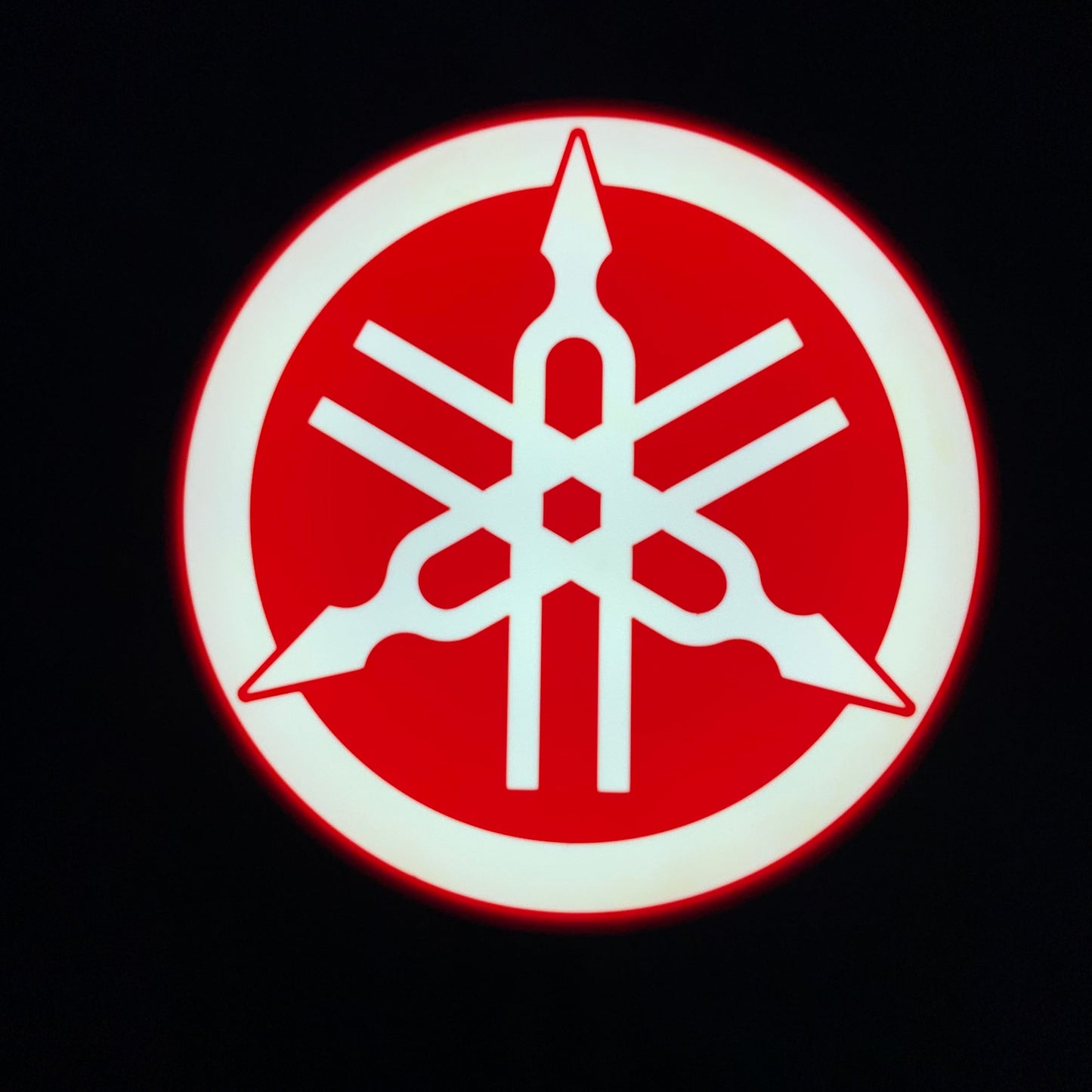 Yamaha led indoor sign lit up on a black background