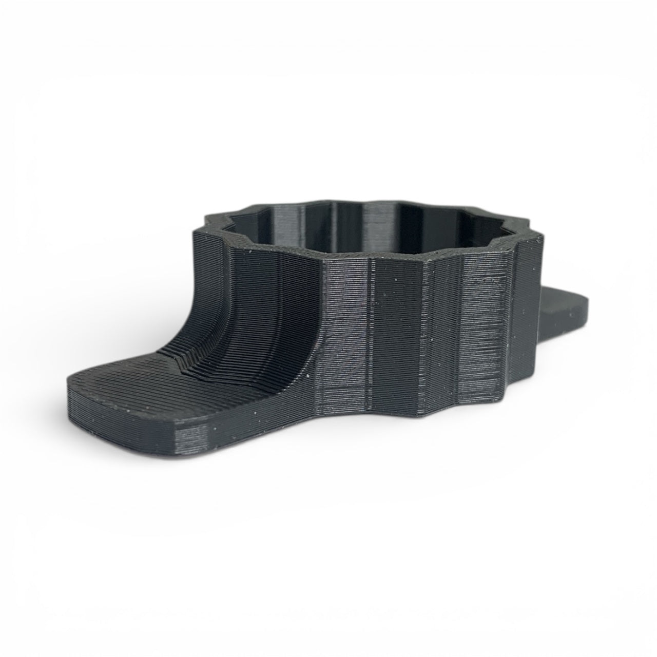 Black 3D-printed object on a white background