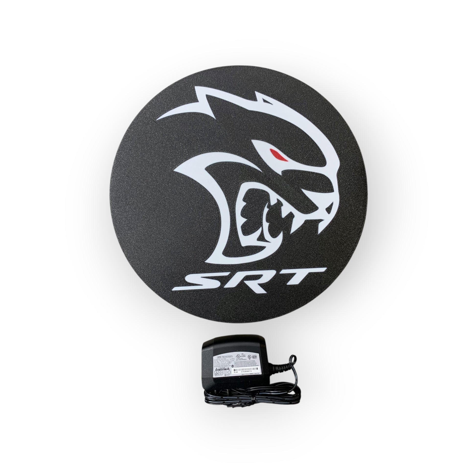 Round black SRT led indoor sign with a power adapter on a white background